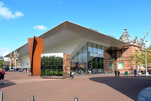The Stedelijk Museum of modern art: the white "bathtub" extension with its glass front next to the old brick building